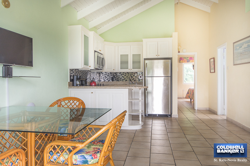 Dining Area + Open Plan Kitchen from Oualie Realty