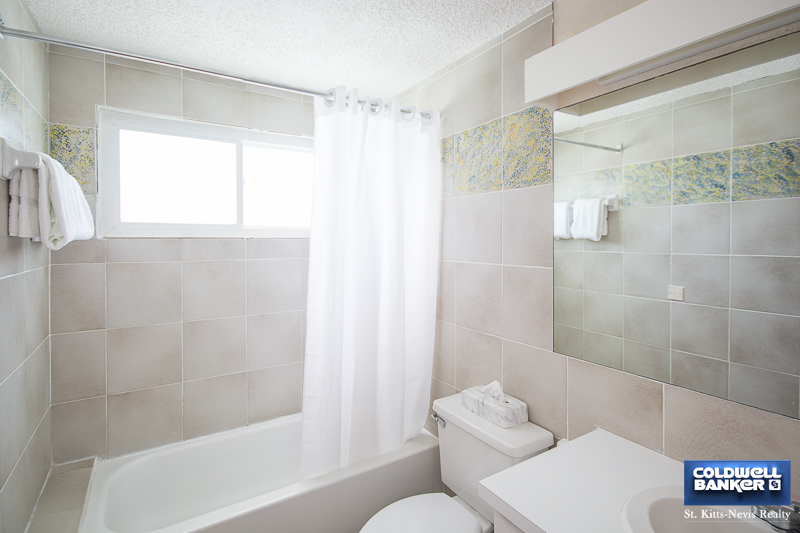 Living Room - Bathroom from Oualie Realty